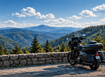 Motorcyclist overlooking a summer mountain valley